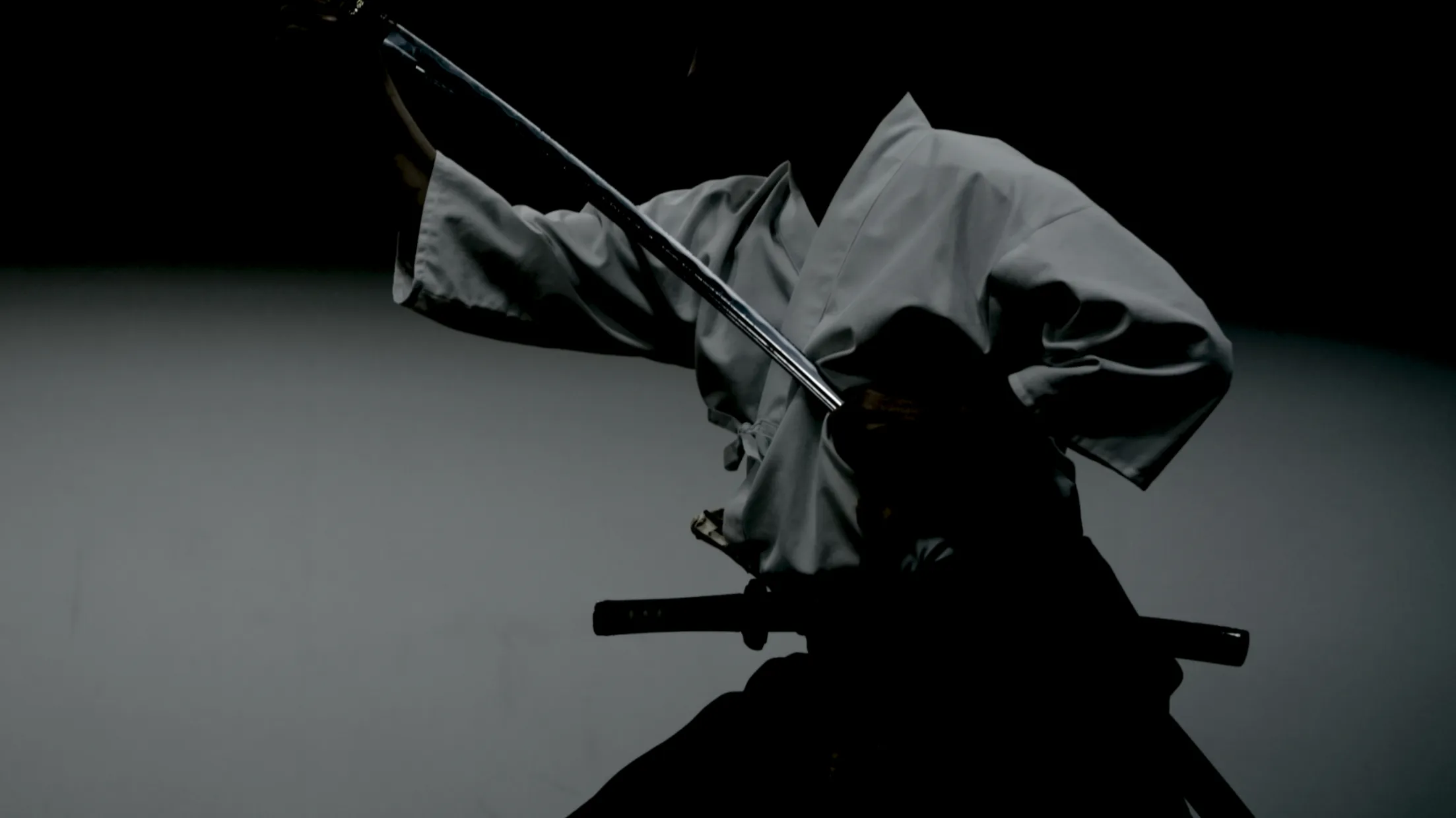 A samurai in motion with a drawn sword